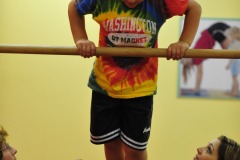 Nicholas takes to the high bar...