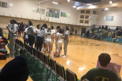 Alex at the end of the "bench" for the Enloe ladies basketball team...