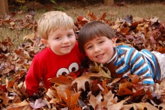 Two brothers in the pile of leaves...