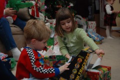 Alexander and Mairin checking out a <B><I>Rescue Heroes</I></B> toy...