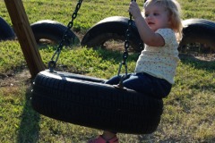 Katie swinging on the tire...
