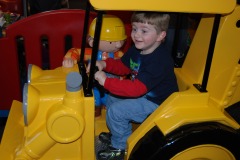 Alexander riding with Scoop and Bob the Builder...