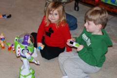 Alexander and Katie playing with Buzz Lightyear...