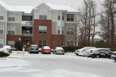 Looking at the apartment across the parking lot...