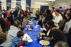 The kids are enjoying their dinner in the cafeteria...