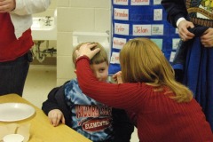 Alexander getting his face painted...
