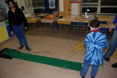 Nicholas lines up his putt...