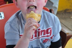 The boy really loves his cone!