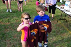 Katie and Alex receive their end-of-season shirts!