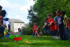Alex does the ball toss...