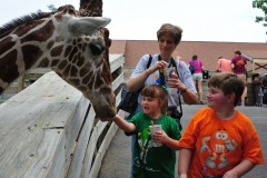Katie and Alex trying their hand at feeding the giraffe...