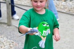 Katie with a parakeet on her stick...