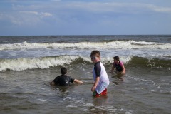 Alex decides to play in the surf...