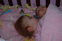 The girl sure loves her dolls!