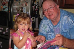 Katie and Gramps checking out a book...