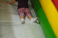 Back down the slide she goes...