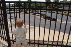 Alex watching the action...and dreaming of the day he'll be driving!