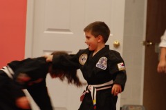 Practicing the new self-defense moves with his partner...
