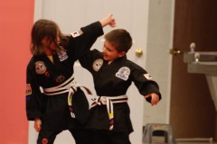 Practicing the new self-defense moves with his partner...
