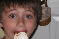 He seems excited about licking the spatula!