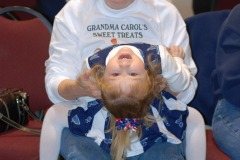 Grandma Carol has a cheerleader in her lap...