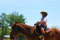 Nicholas riding tall in the saddle on Pete!