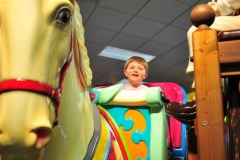 Alex enjoying a ride on the rocking horse...