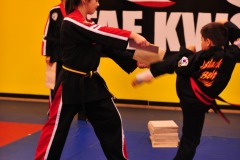 Breaking the board with a tornado kick...