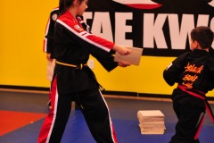 Breaking the board with a tornado kick...