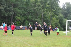 Nicholas takes a shot on goal...
